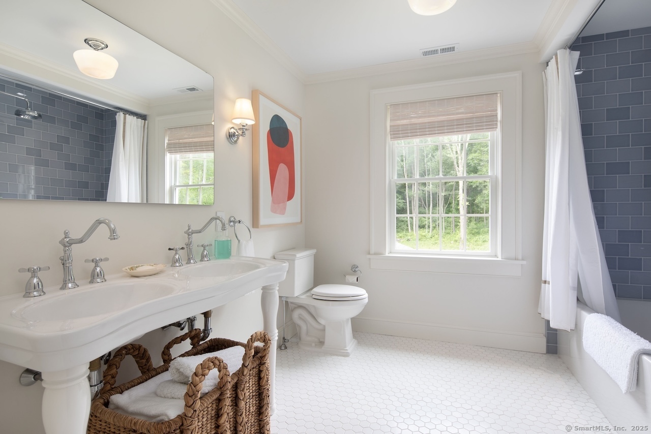 200 Sharon Mountain Road Sharon, CT 06069 - Photo 26 of 29 a bathroom with a sink toilet and a mirror