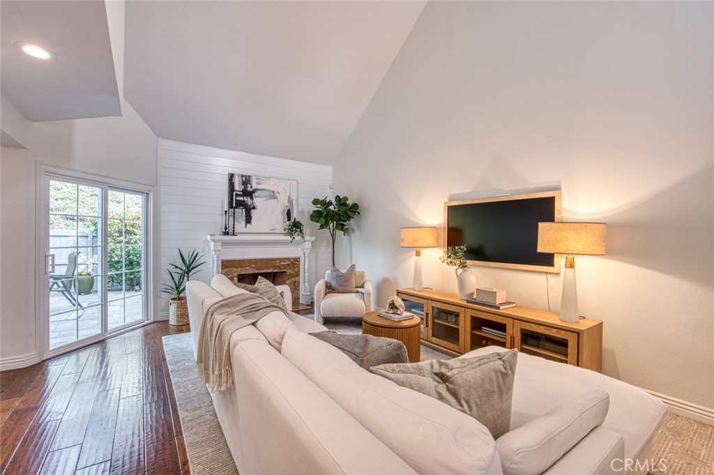 29276 Rue Cerise Laguna Niguel, CA 92677 - Photo 4 of 22 Formal living room with gas fireplace and two-story ceilings
