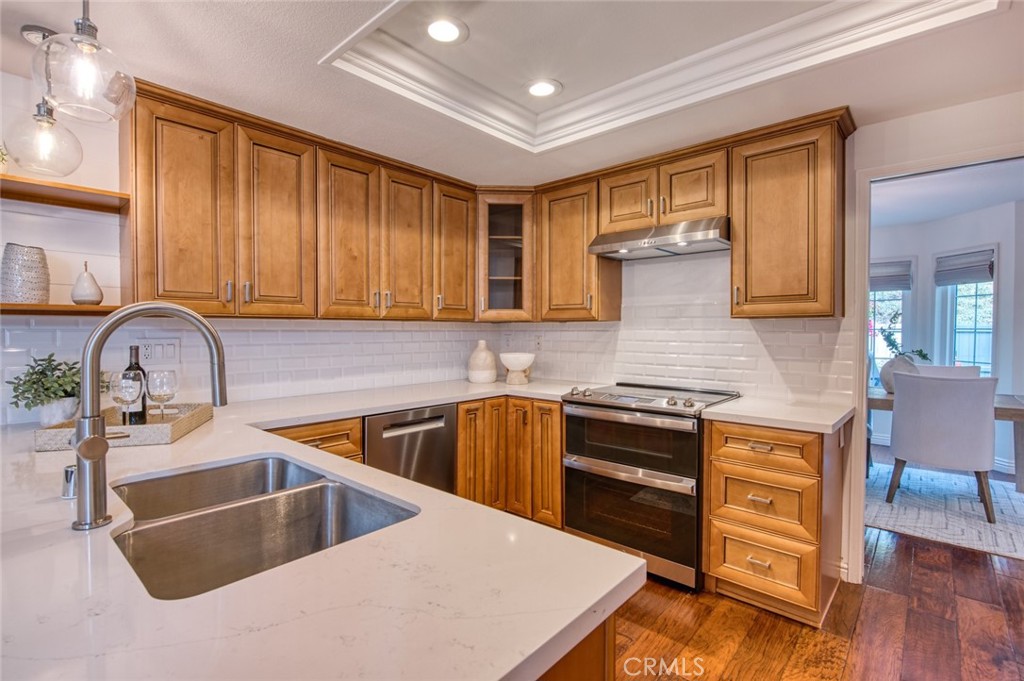 29276 Rue Cerise Laguna Niguel, CA 92677 - Photo 7 of 22 Newer appliances (refrigerator included), quartz countertops and timeless subway tile.