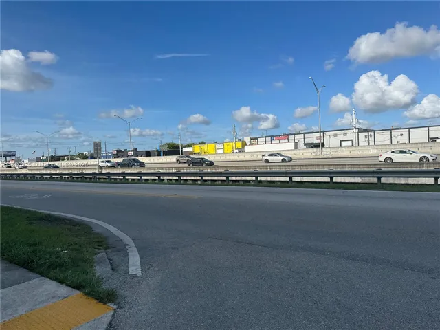 a view of a swimming pool with outdoor seating
