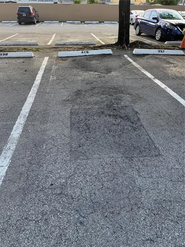 a view of car parked on the side of the road