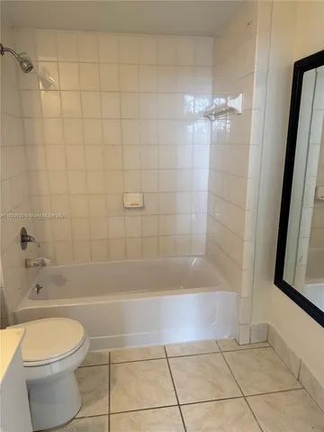a bathroom with a bathtub and a toilet