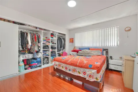 a bed room with a bed and a large window