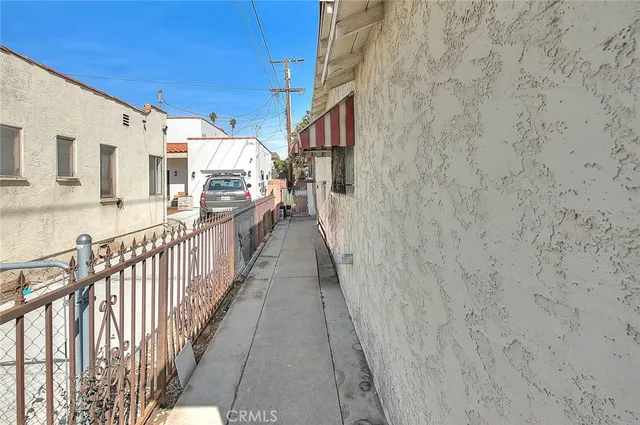 a view of a street with brick wall