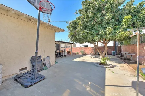 a view of a patio in the backyard