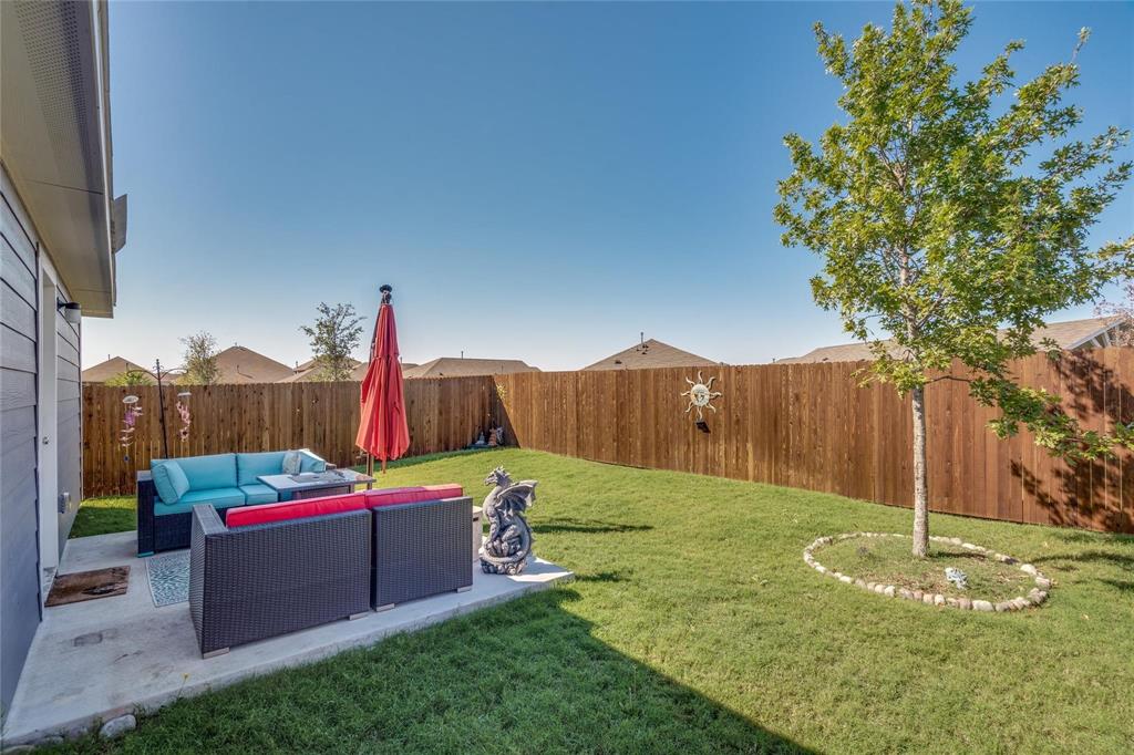 7733 Ruellia Road McKinney, TX 75071 - Photo 16 of 19 Fenced backyard with an outdoor hangout area and a patio area