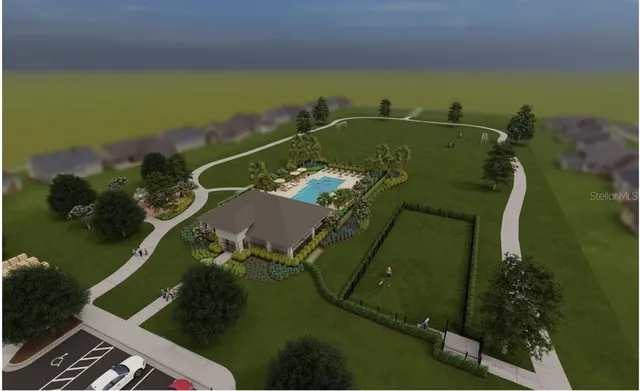 an aerial view of a house with a yard