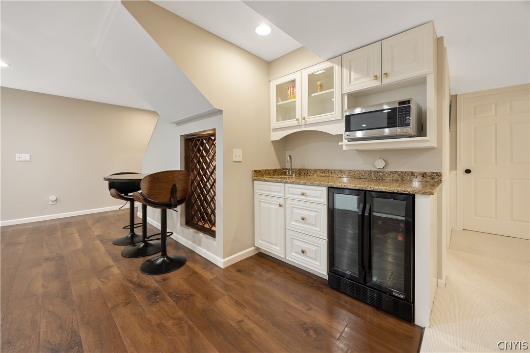 6198 Rossiter Road DeWitt, NY 13078 - Photo 27 of 39 Wet bar and wine cooler, perfect guest get away!!