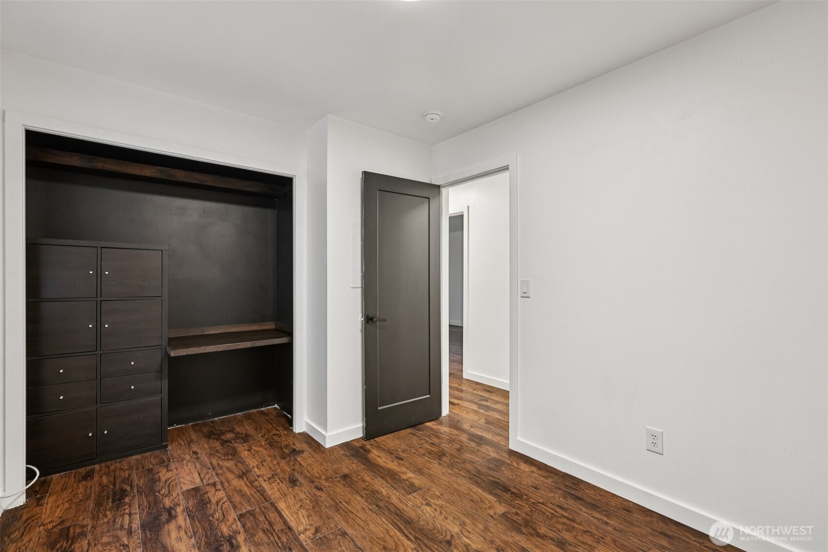 2210 Grade Road, Unit 7 Lake Stevens, WA 98258 - Photo 21 of 27 a view of an empty room with closet and wooden floor