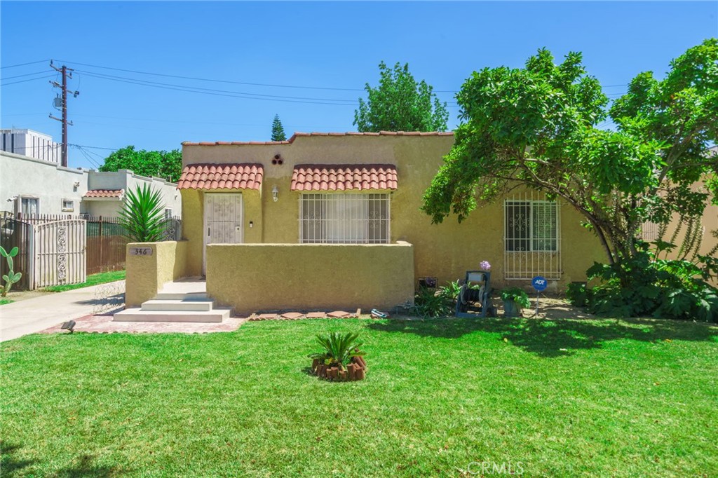 346 West School Street Compton, CA 90220 - Photo 1 of 29 a front view of a house with a yard