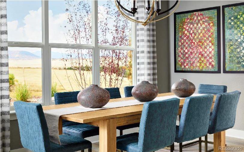 3 Simmental Loop Castle Rock, CO 80104 - Photo 7 of 22 a view of a dining room with furniture and windows