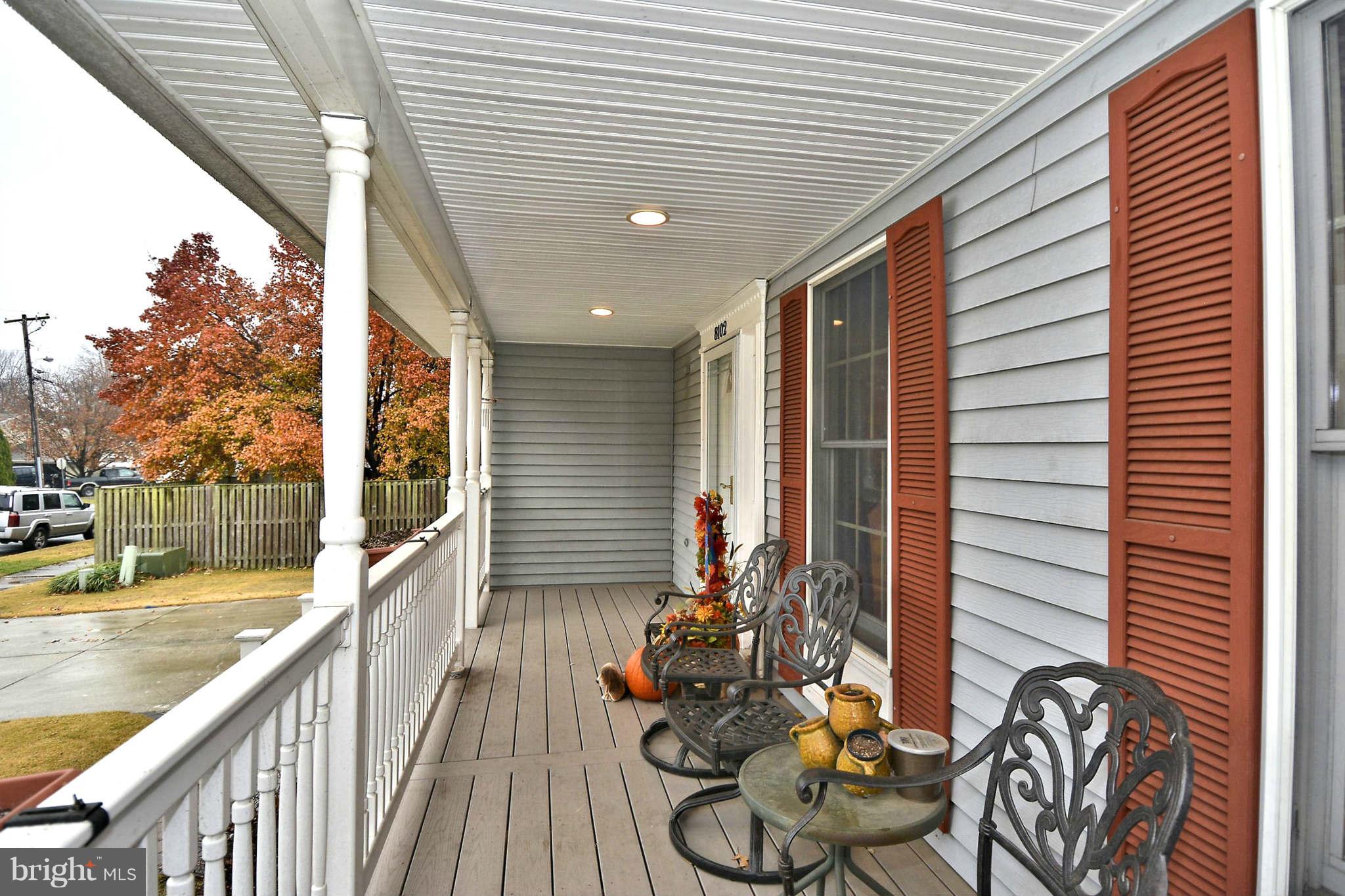 8102 Walton Road Severn, MD 21144 - Photo 1 of 30 a balcony with furniture and wooden floor