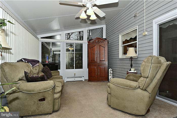 8102 Walton Road Severn, MD 21144 - Photo 12 of 30 a living room with furniture and a fireplace