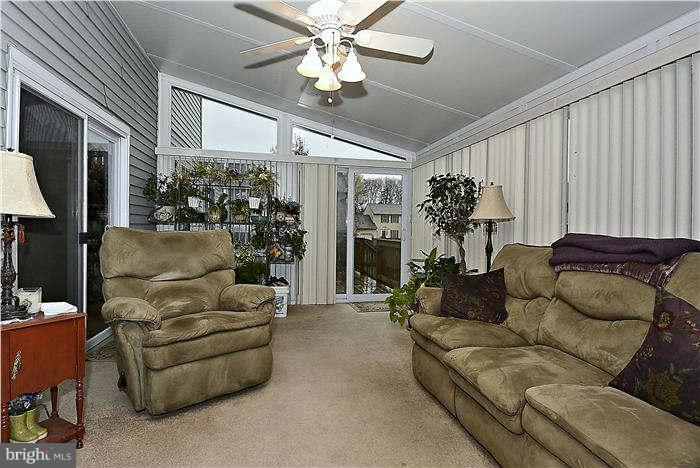 8102 Walton Road Severn, MD 21144 - Photo 13 of 30 a living room with furniture and a potted plant