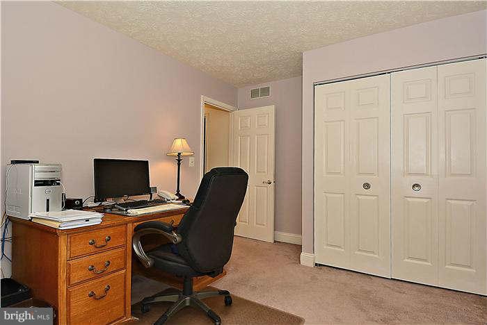 8102 Walton Road Severn, MD 21144 - Photo 24 of 30 a view of a workspace with furniture and a window