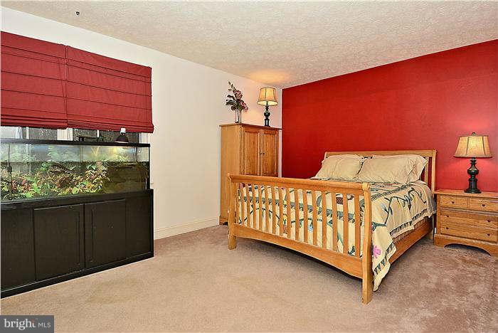 8102 Walton Road Severn, MD 21144 - Photo 25 of 30 a bedroom with a bed and window