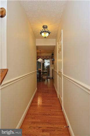 8102 Walton Road Severn, MD 21144 - Photo 26 of 30 a view of a hallway with wooden floor