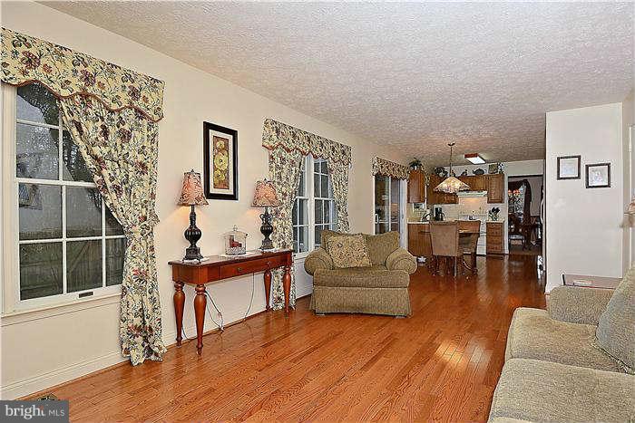 8102 Walton Road Severn, MD 21144 - Photo 10 of 30 a living room with furniture and wooden floor