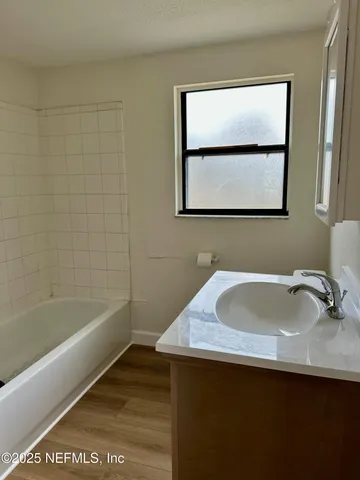 a bathroom with a sink and a bathtub