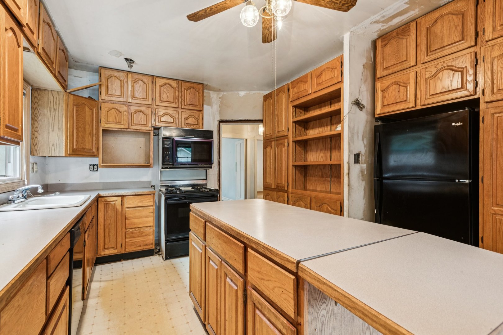 327 Keystone Avenue River Forest, IL 60305 - Photo 11 of 38 a kitchen with stainless steel appliances granite countertop a refrigerator a stove and a sink with cabinets
