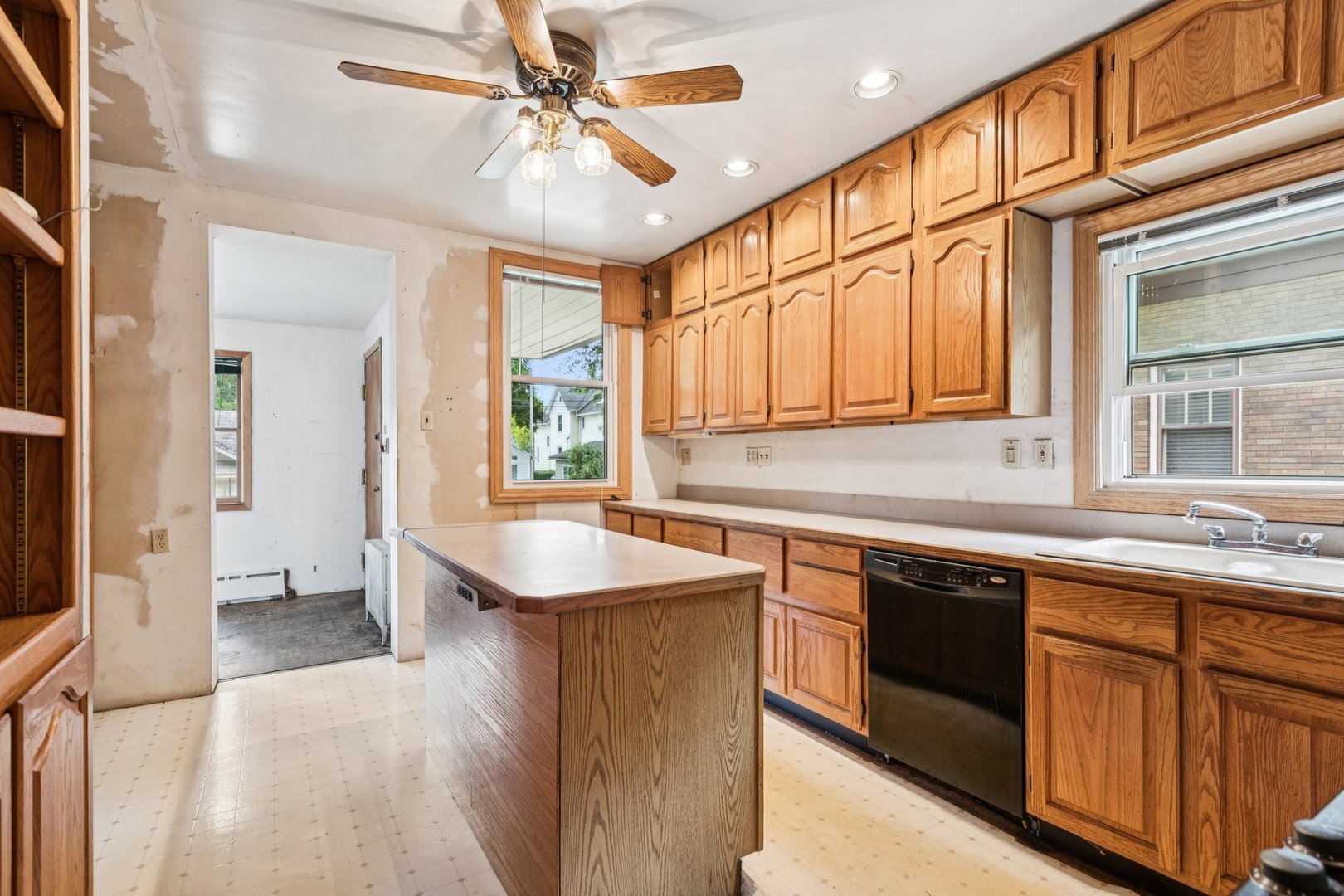 327 Keystone Avenue River Forest, IL 60305 - Photo 9 of 38 a kitchen with stainless steel appliances granite countertop a sink and dishwasher a stove with wooden floor