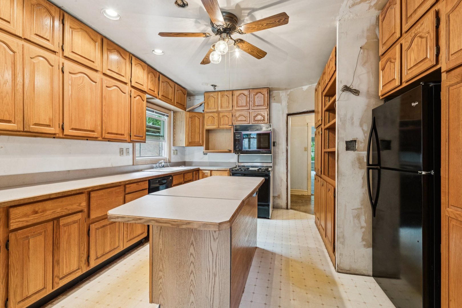 327 Keystone Avenue River Forest, IL 60305 - Photo 10 of 38 a kitchen with cabinets and stainless steel appliances