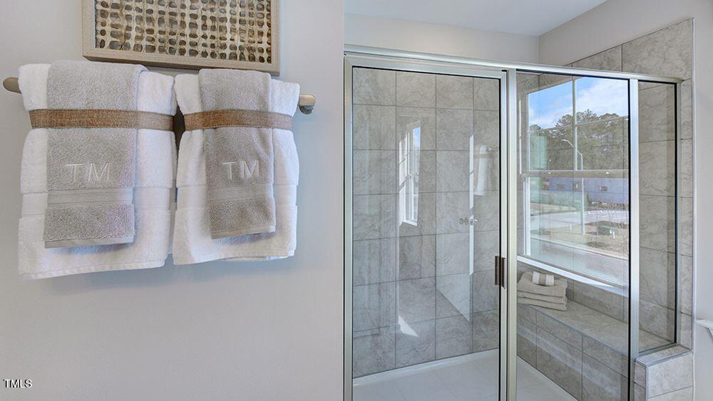 408 Carpels Drive Wendell, NC 27591 - Photo 12 of 31 a bathroom with a shower and a sink