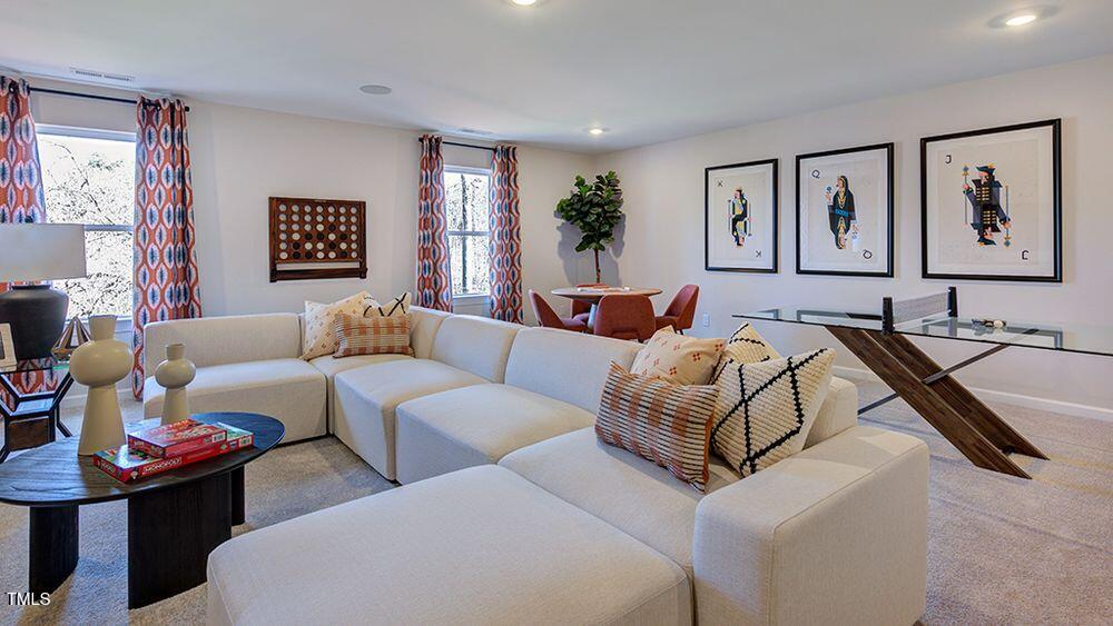 408 Carpels Drive Wendell, NC 27591 - Photo 18 of 31 a living room with furniture and a flat screen tv