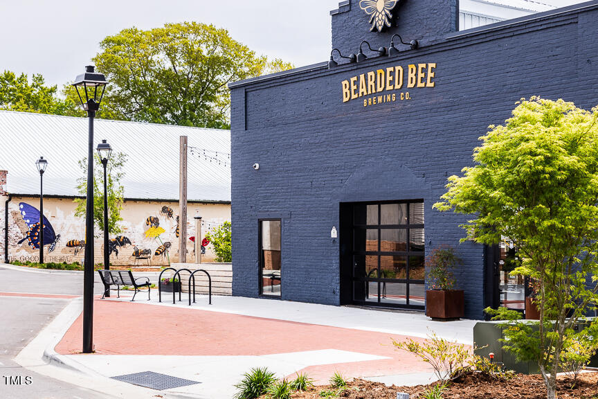 408 Carpels Drive Wendell, NC 27591 - Photo 26 of 31 a pathway sign on the side of building