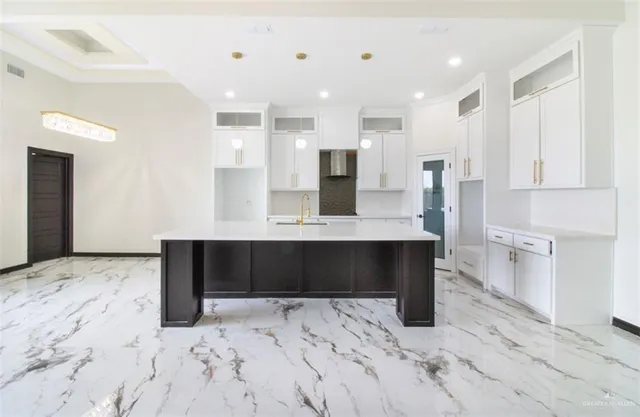 a large bathroom with a sink and a mirror