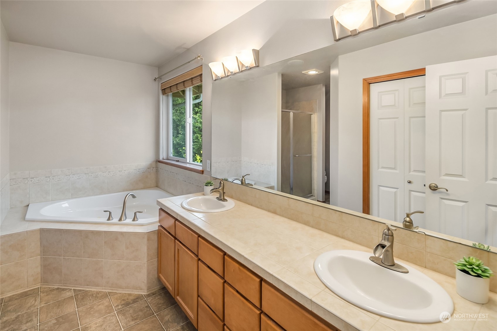 307 197th Place Southwest Bothell, WA 98012 - Photo 21 of 30 a bathroom with a sink double vanity and a mirror