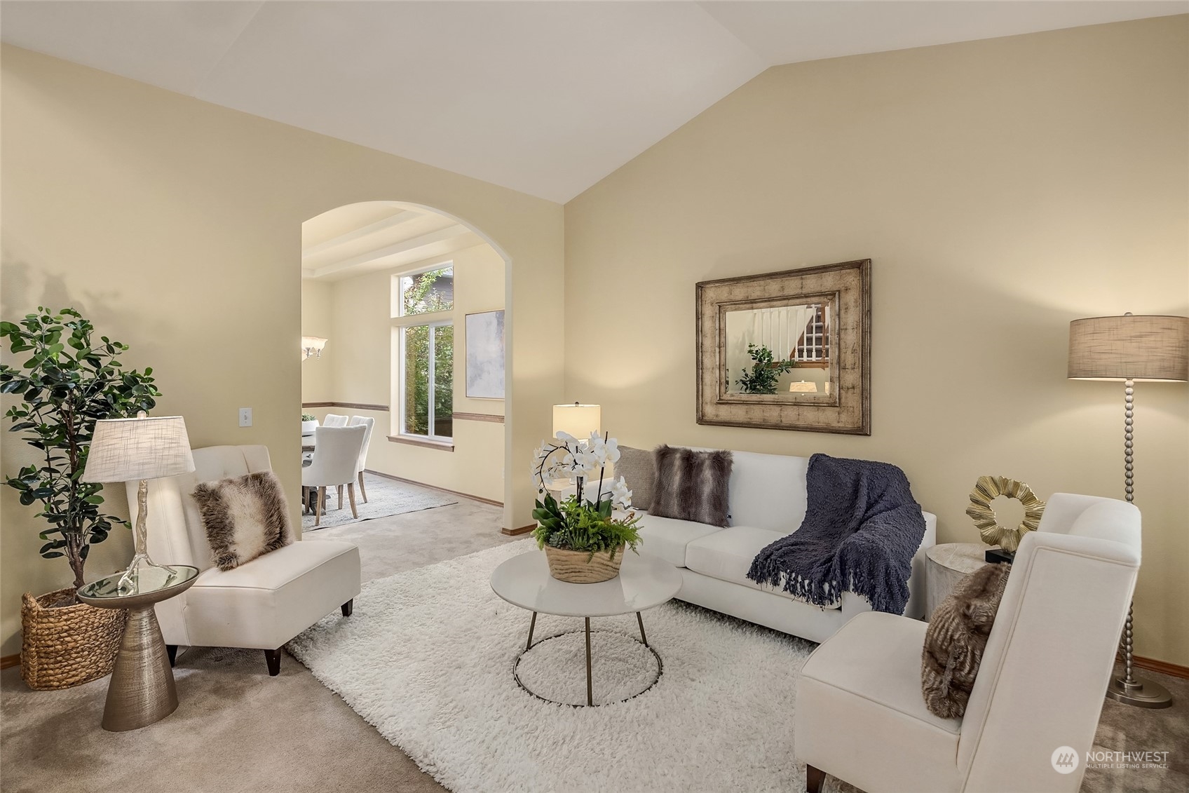 307 197th Place Southwest Bothell, WA 98012 - Photo 3 of 30 a living room with furniture a lamp paintings and a window