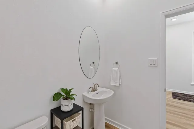 a bathroom with a sink a mirror and a shower