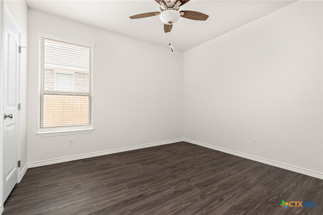5219 Rose Gdn Loop Killeen, TX 76542 - Photo 12 of 19 an empty room with a window and wooden floor