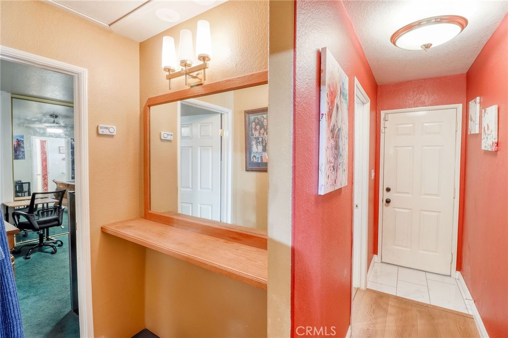20430 Rancherias Road Apple Valley, CA 92307 - Photo 15 of 48 a view of a hallway and a livingroom with furniture