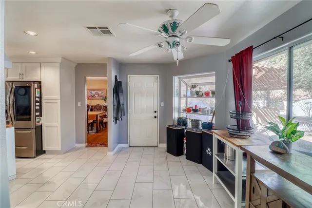 a bedroom with furniture and a baby crib