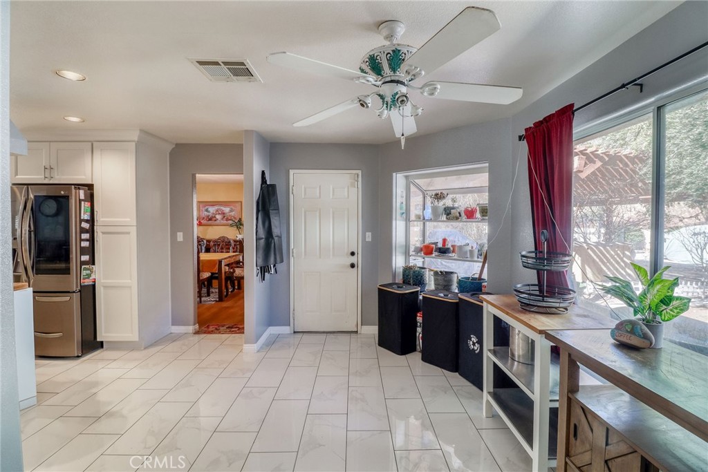 20430 Rancherias Road Apple Valley, CA 92307 - Photo 16 of 48 a view of a kitchen with stainless steel appliances granite countertop a refrigerator and a sink