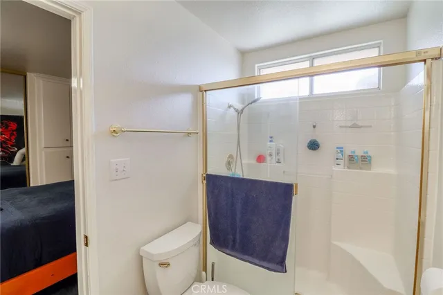 a bedroom with furniture and a rug