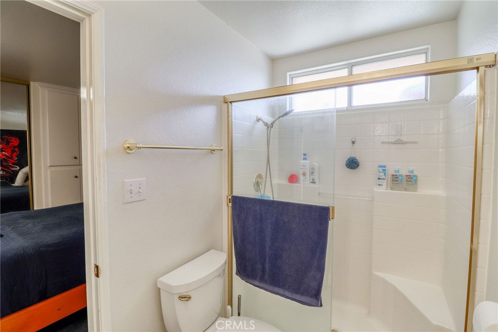 20430 Rancherias Road Apple Valley, CA 92307 - Photo 18 of 48 a bathroom with a shower and a toilet