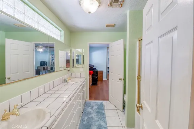 a bedroom with bed and window