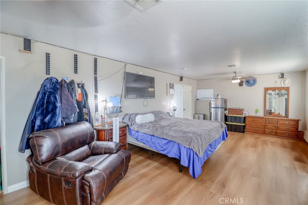 20430 Rancherias Road Apple Valley, CA 92307 - Photo 27 of 48 a living room with furniture and a wooden floor