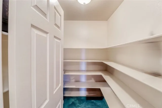 a white toilet sitting next to a bathroom sink and a shower