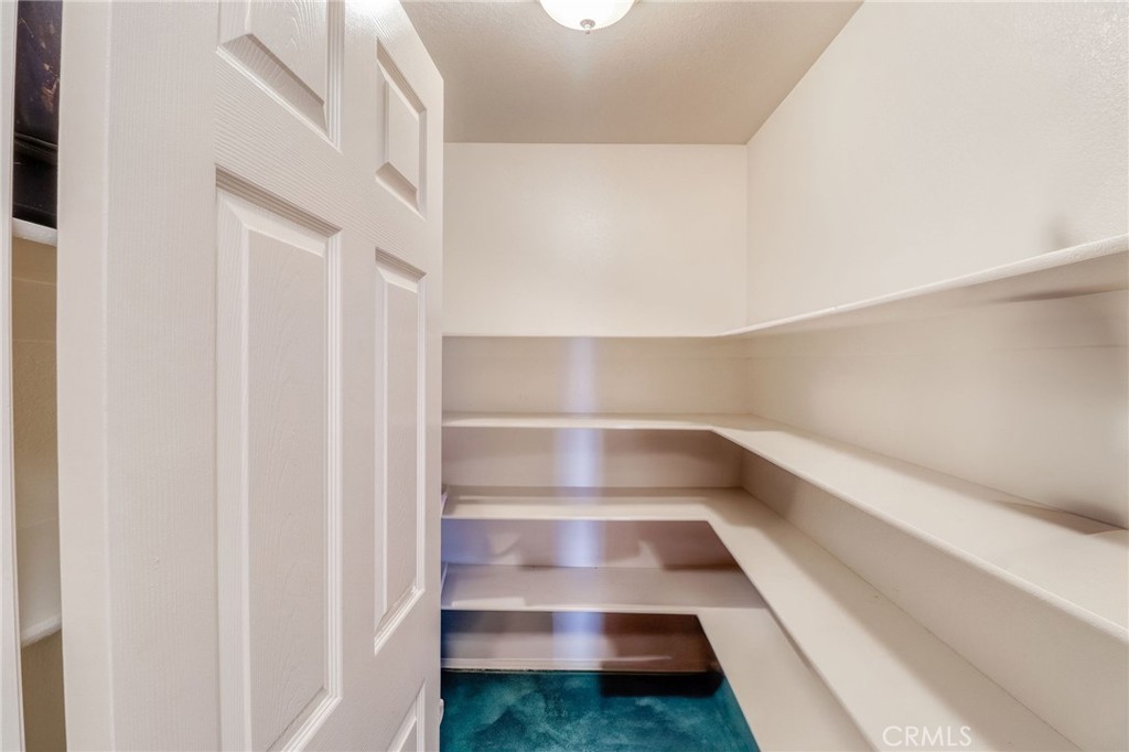 20430 Rancherias Road Apple Valley, CA 92307 - Photo 31 of 48 a view of walk in closet with empty racks