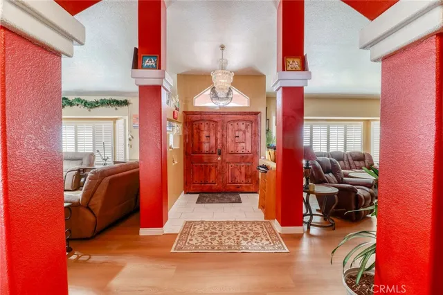 a view of living room kitchen and entryway