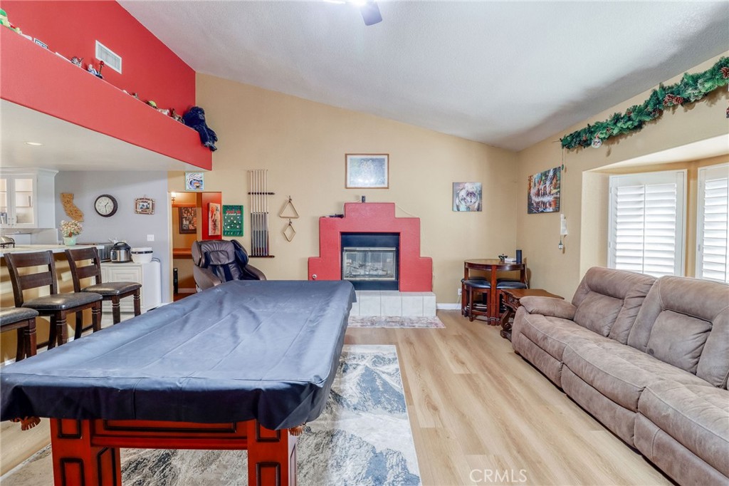 20430 Rancherias Road Apple Valley, CA 92307 - Photo 5 of 48 a living room with furniture and a wooden floor