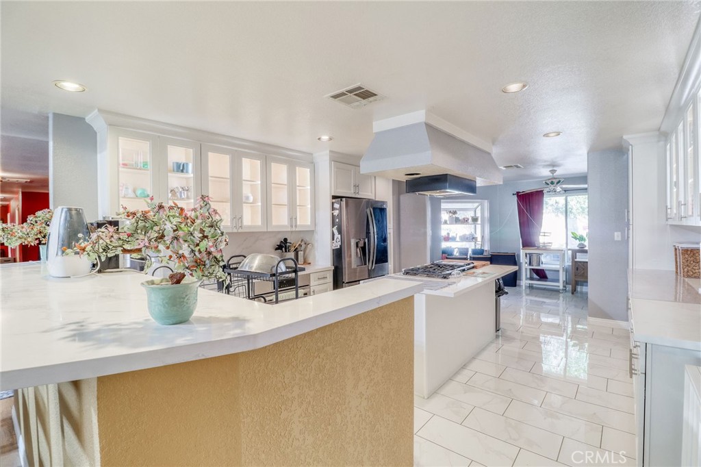 20430 Rancherias Road Apple Valley, CA 92307 - Photo 7 of 48 a kitchen with counter top space and living room