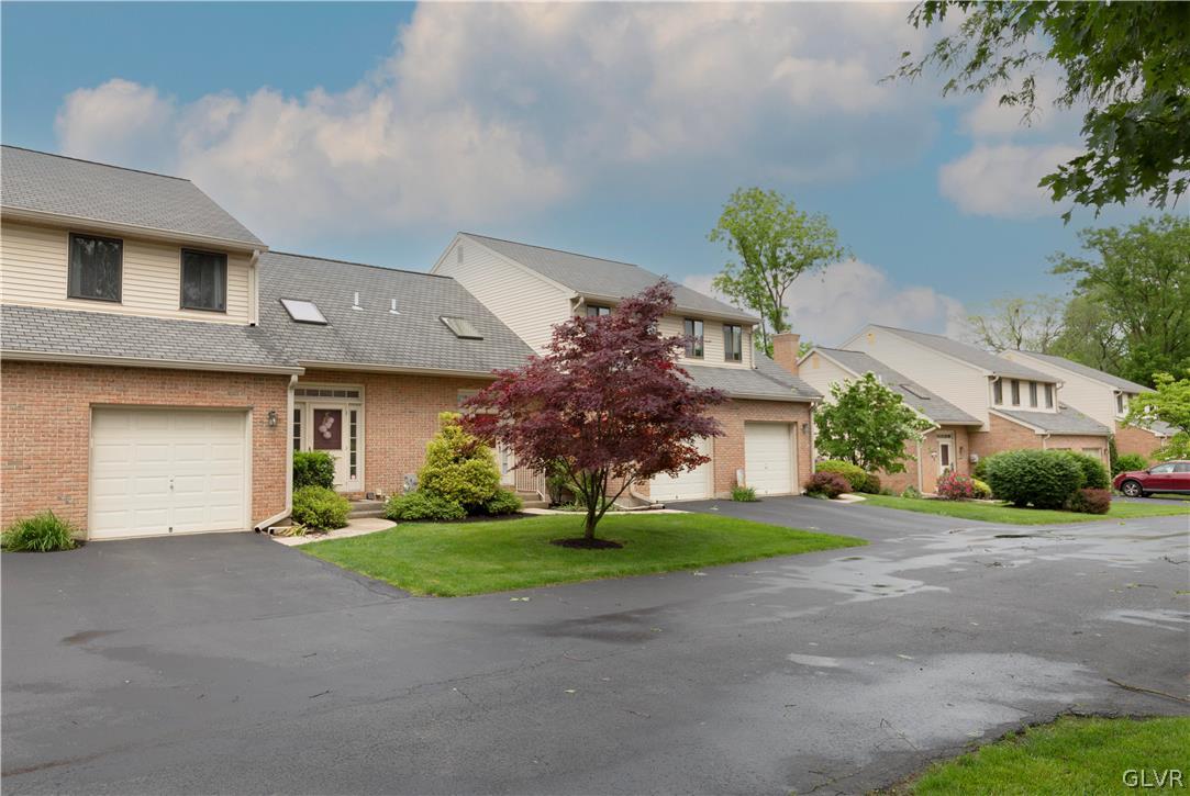 1201 Butztown Road, Unit 6 Bethlehem, PA 18017 - Photo 2 of 20 a front view of a house with a yard and garage