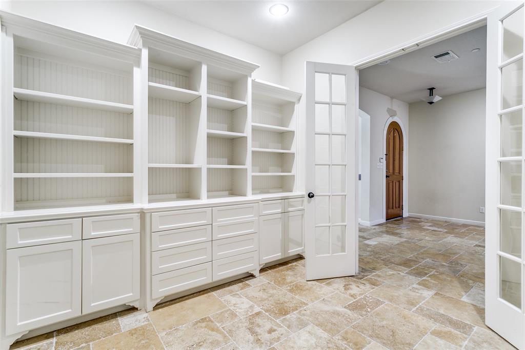 8608 Augustine Road Irving, TX 75063 - Photo 11 of 26 a view of walk in closet with empty racks