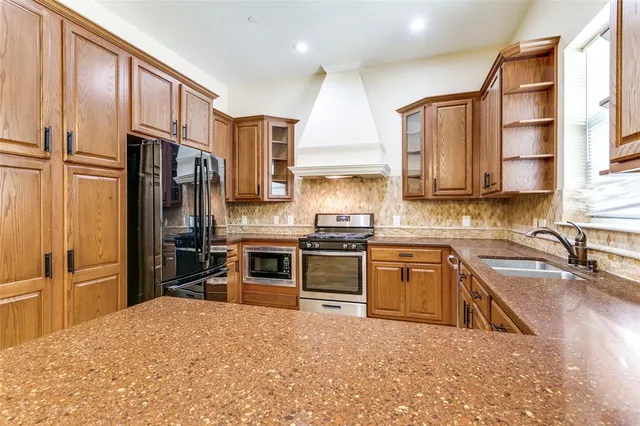 a kitchen with a sink and cabinets