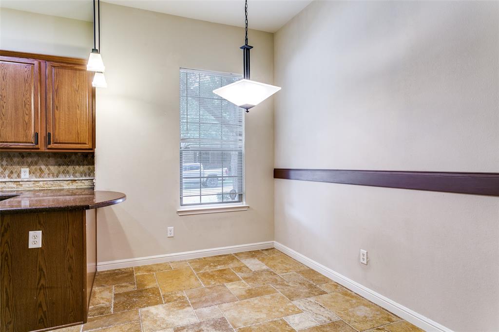8608 Augustine Road Irving, TX 75063 - Photo 15 of 26 a view of an empty room with chandelier and a window
